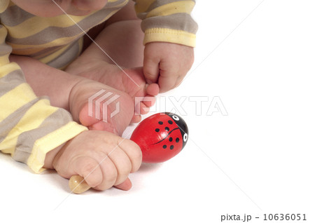 Baby hand with red toy 10636051