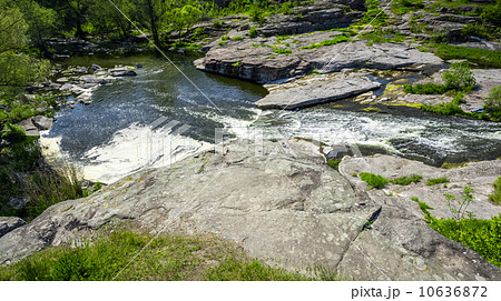 landscape of forest and fast mountain river 10636872