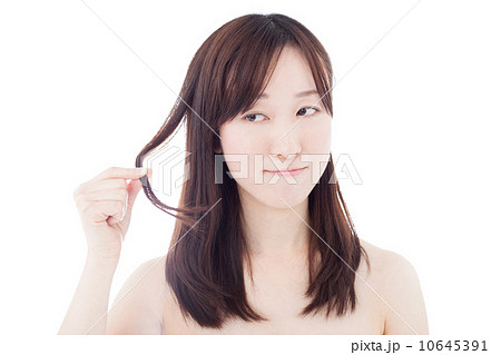 髪に触る女性の写真素材