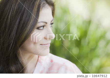 A woman outdoors smiling 10647912