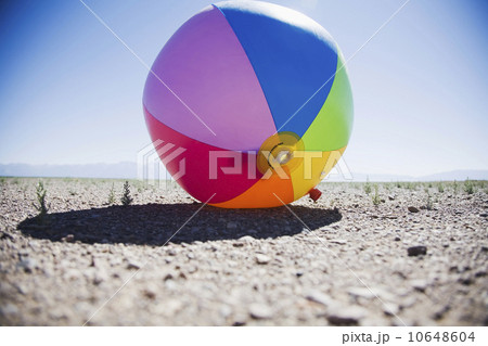 Beach ball in dry field Beach ball in dry field 10648604