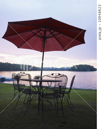 A patio set by a lake 10648623