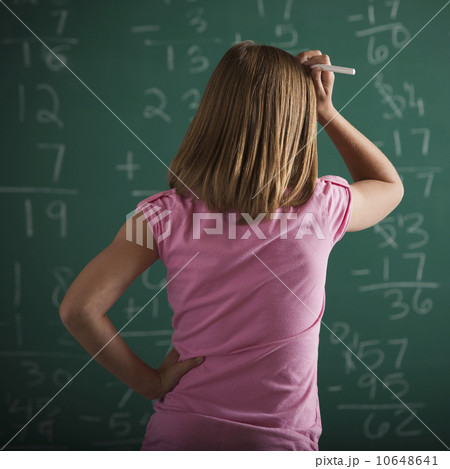 Student in front of chalkboard 10648641