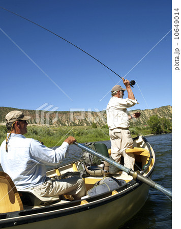 USA, Colorado, Pair of men fly-fishing on mountain river USA, Colorado, Pair of men fly-fishing on mountain river 10649014