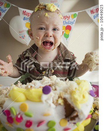 Baby covered in birthday cake 10649025