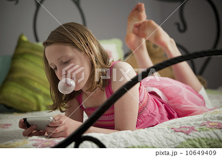 Young girl texting 10649409