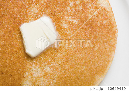 Pancake and butter on plate 10649419