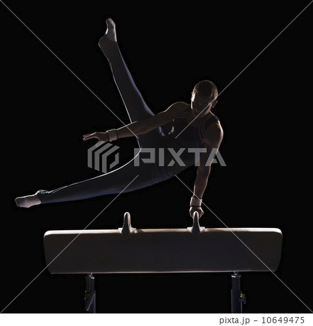 Male gymnast on pommel horse Male gymnast on pommel horse 10649475