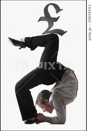 Pound symbol on top of contorted businesswoman Pound symbol on top of contorted businesswoman 10649501