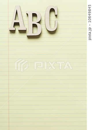 Letters A, B and C on yellow legal pad 10649845