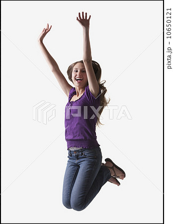 Teenage girl jumping for joy 10650121