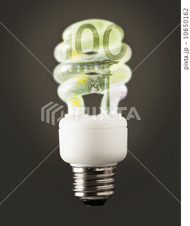 Composition of energy efficient bulb and one hundred euro note 10650162