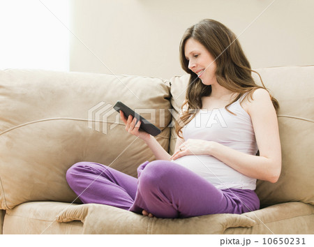 USA, Utah, Lehi, Young pregnant woman looking at CT image of unborn baby USA, Utah, Lehi, Young pregnant woman looking at CT image of unborn baby 10650231