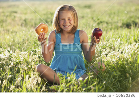 Young girl making food choice 10650236