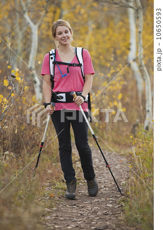 USA, Utah, young woman walking on trail 10650593