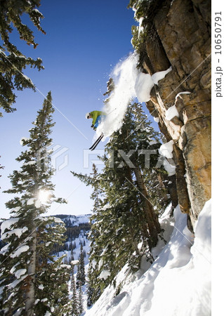 Skier jumping off cliff Aspen Snowmass, Aspen, Colorado, USA  10650791