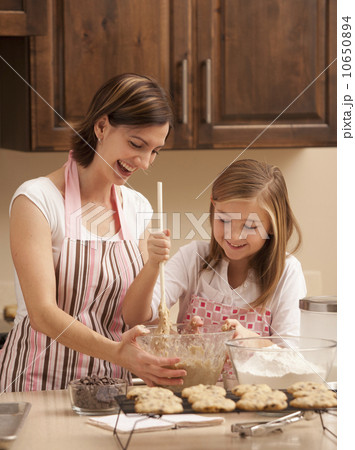 Mother baking with daughter (10-11) in kitchen Mother baking with daughter (10-11) in kitchen 10650894