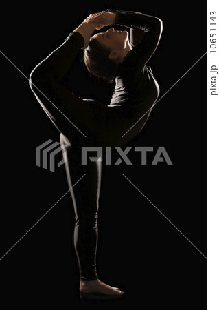 Female contortionist on black background Female contortionist on black background 10651143