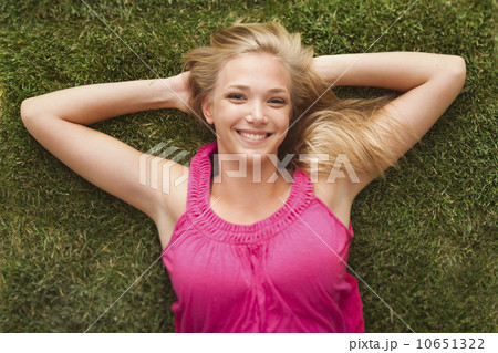 Young girl (16-17) lying on grass Young girl (16-17) lying on grass 10651322