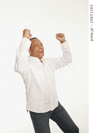 Happy man with his arms raised 10651565