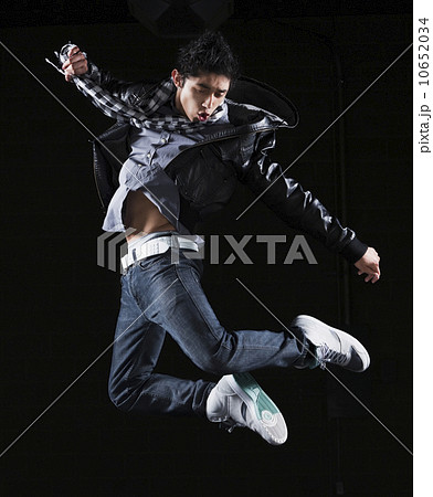 Hip hop dancer jumping in the air 10652034