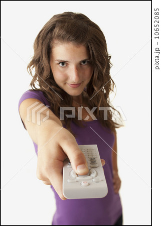Young woman holding remote control 10652085