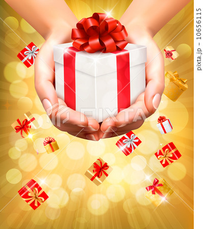 Holiday background with hands holding gift boxes. Concept of giv Holiday background with hands holding gift boxes. Concept of giv 10656115