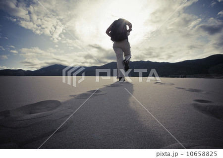 USA, Colorado, Great Sand Dunes National Park, Low angle view of tourist walking 10658825