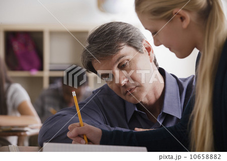 Teacher with teenage students (14-15) at school Teacher with teenage students (14-15) at school 10658882
