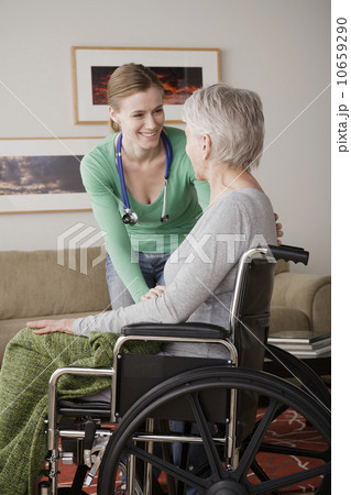 Young female nurse taking care of senior woman Young female nurse taking care of senior woman 10659290