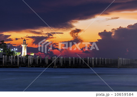 Lighthouse with dramatic sky in background Lighthouse with dramatic sky in background 10659584