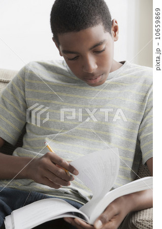 Boy (14-15) studying 10659869