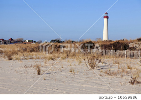 Lighthouse on beach Lighthouse on beach 10659886