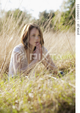 Young woman relaxing on meadow Young woman relaxing on meadow 10660101