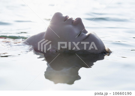 Woman relaxing in lake Woman relaxing in lake 10660190