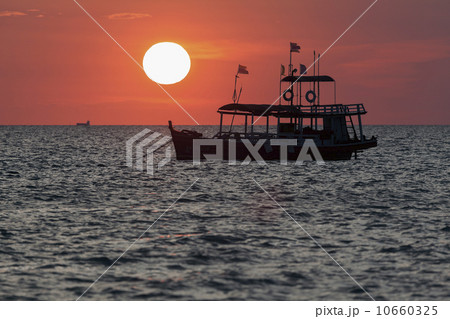 Trawler against setting sun 10660325