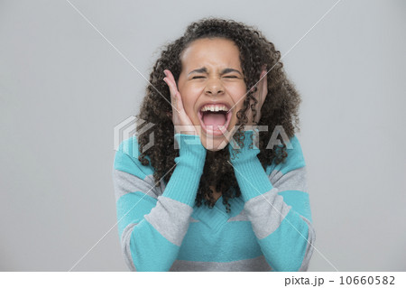 Portrait of girl (12-13) screaming 10660582