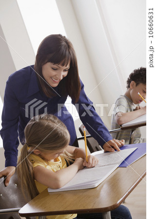 Pupils and teacher in classroom Pupils and teacher in classroom 10660631