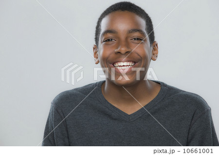 Portrait of teenage boy (14-15) smiling 10661001