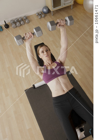 Young woman exercising Young woman exercising 10661471