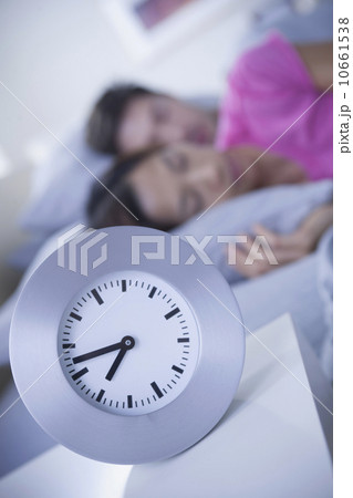 Close up of alarm clock on bedside table Close up of alarm clock on bedside table 10661538