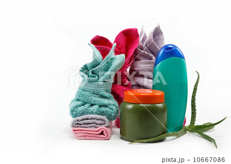 Spa or bathroom concept with towels and soaps, on a white backgr 10667086