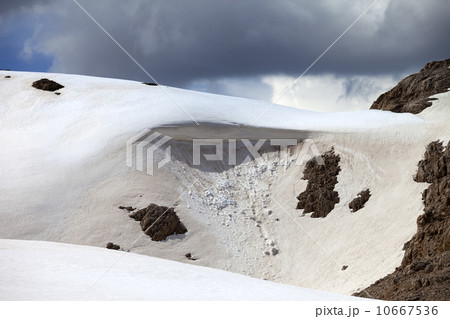 Snow cornice in mountains Snow cornice in mountains 10667536