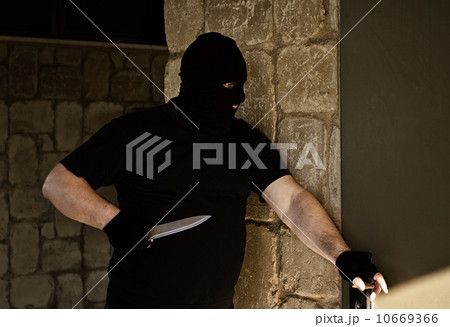 Murderer is ready to break into the house 10669366