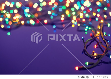 Christmas lights on dark blue background with copy space. Decora Christmas lights on dark blue background with copy space. Decora 10672565