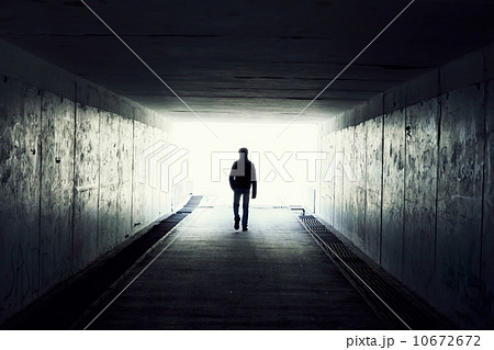 Silhouette of Man Walking in Tunnel. Light at End of Tunnel 10672672