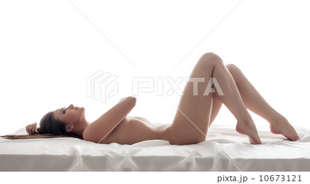 Curvy slim model posing lying naked in bed 10673121