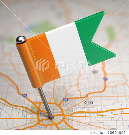 Cote d'Ivoire Small Flag on a Map Background. 10674065