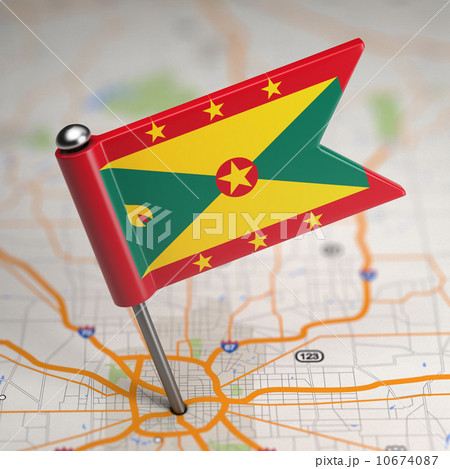 Grenada Small Flag on a Map Background. 10674087