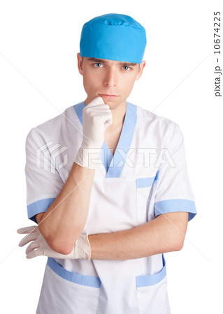 The young serious medical doctor in gloves isolated on white bac 10674225
